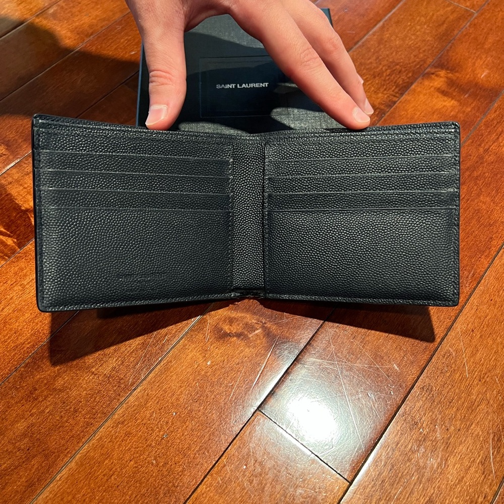 Authentic Saint Laurent men’s navy blue leather wallet.